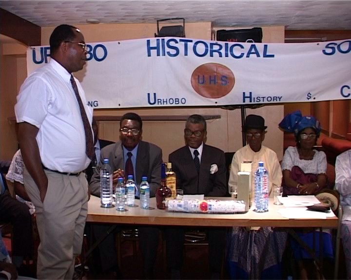 Mr. Ejiro Ughwujabo, Standing, Presents Gifts On Behalf of Welcoming UK & Belgium Organizing Committee To Participants From Afar